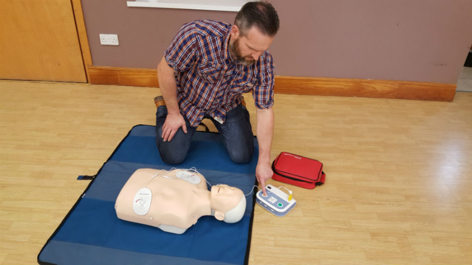Trainee illustrates how to operate an AED by effectively administrating the shock